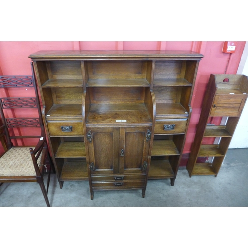 10 - An Arts and Crafts oak open breakfront bookcase