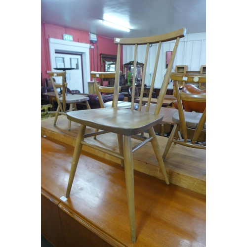 101 - A set of four Ercol Blonde elm and beech 391 model chairs