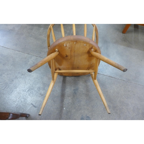 102 - An Ercol Blonde elm and beech cow horn chair