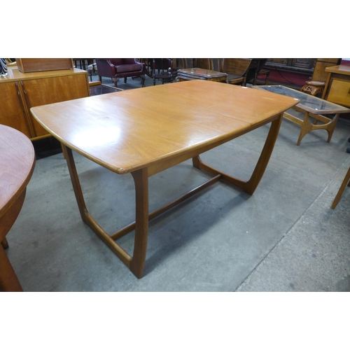 116 - A Danish style teak extending dining table