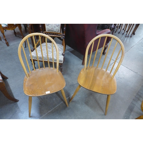 123 - A pair of Ercol Blonde elm and beech Windsor chairs
