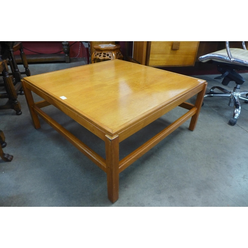 135 - A teak square coffee table