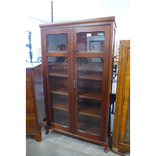 147 - A pitch pine and mahogany two door bookcase