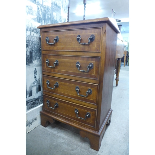 156 - A small inlaid mahogany chest of drawers