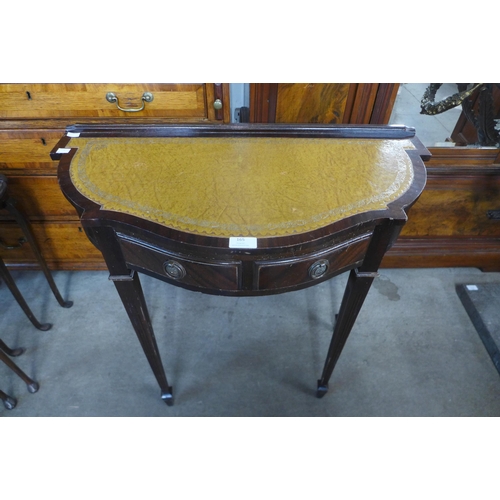 165 - A small mahogany serpentine demi-lune side table