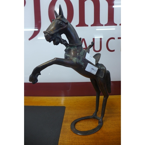 23 - A bronze figure of a rearing horse