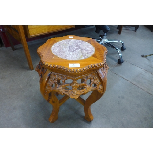 24 - A Chinese carved softwood and marble topped jardiniere stand