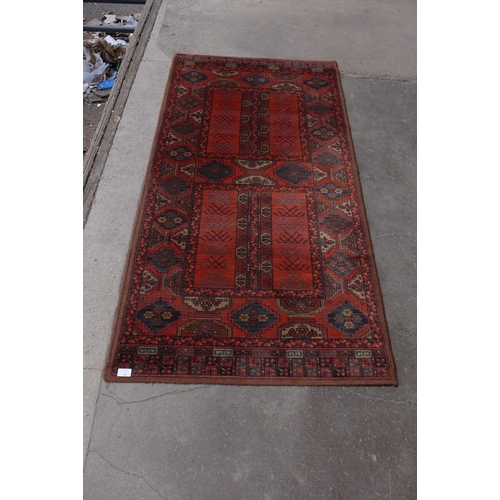 243 - An eastern red ground rug