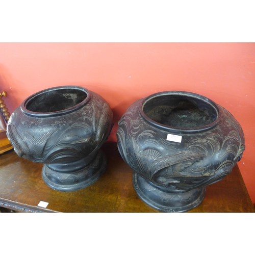 26 - A pair of Japanese bronze urns