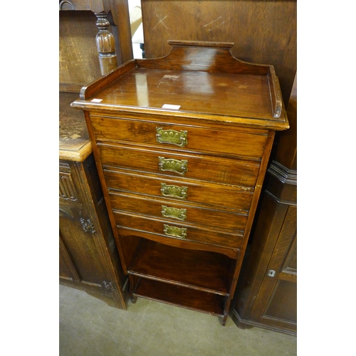 261 - An Arts and Crafts mahogany music cabinet