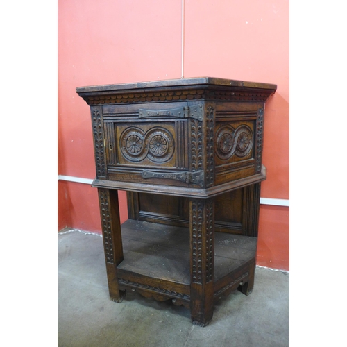 30 - A 17th Century style carved oak credence cupboard