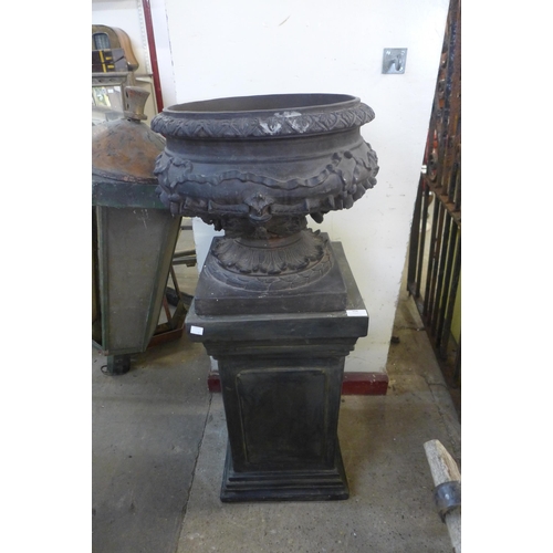 304 - A reproduction Neo-Classical style urn on pedestal