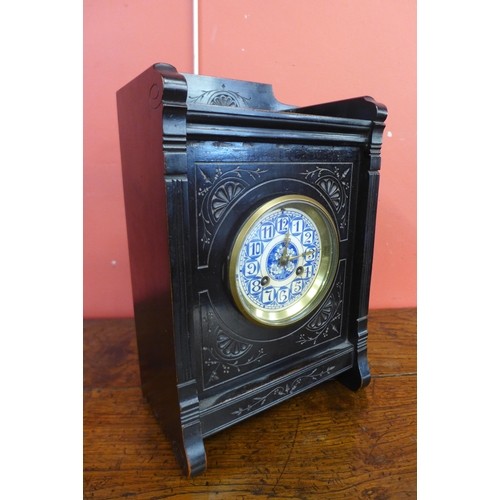 31 - A Victorian Aesthetic Movement ebonised bracket clock
