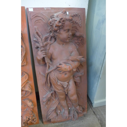 317 - A faux terracotta cherub plaque