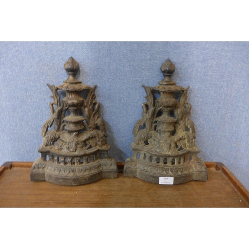 319 - A pair of cast iron andirons, a/f