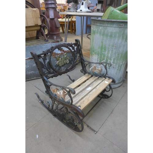 341 - A child's cast iron ended rocking chair