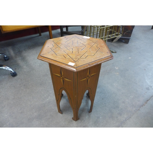 38 - An Arts and Crafts Moorish style inlaid walnut hexagonal occasional table
