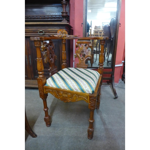 43 - An eastern carved softwood corner chair