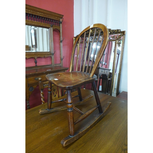 63 - A Victorian elm Windsor rocking chair