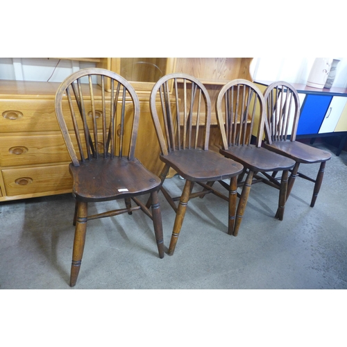 67 - A set of four 19th Century ash and elm Windsor kitchen chairs
