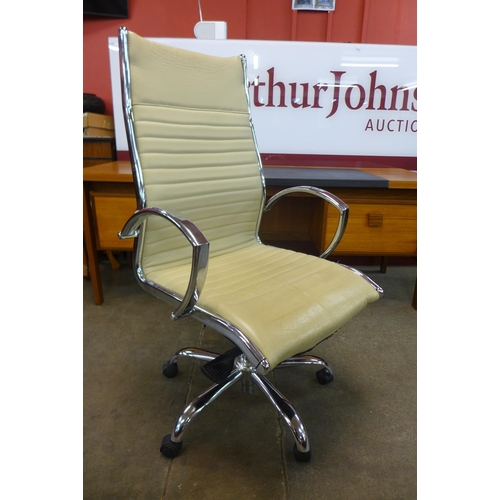 76 - A chrome revolving desk chair