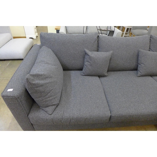 1311 - A grey upholstered designer corner sofa with footstool/ottoman