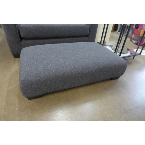 1312 - A grey upholstered designer cuddle chair and footstool