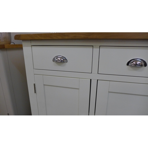 1332 - A Hampshire white painted oak three door large sideboard repaired and marked (KEL P05-82) * this lot... 