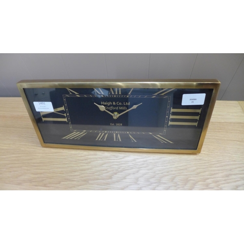 1469 - A rectangular black clock with gold Roman numerals, 36 x 16cms (7520420)   #