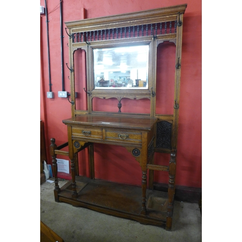 13 - A large Victorian Aesthetic Movement carved oak hallstand, manner of Bruce Talbert