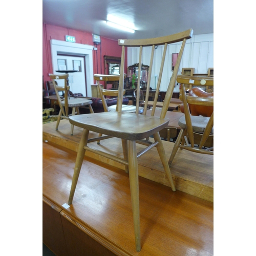 123 - A set of four Ercol Blonde elm and beech 391 model chairs