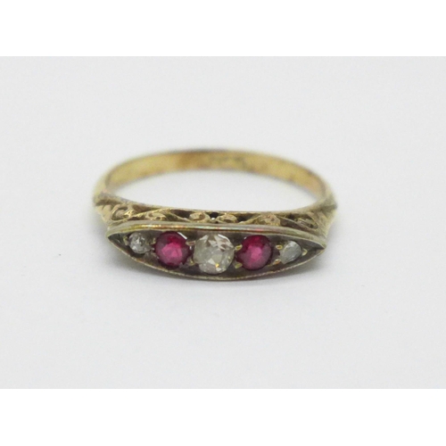 1006 - An 18ct gold ring set with two rubies, two diamonds and one small replacement white stone, 2.1g, N