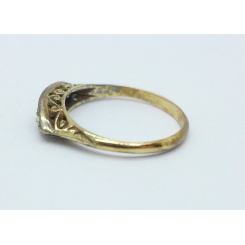 1006 - An 18ct gold ring set with two rubies, two diamonds and one small replacement white stone, 2.1g, N