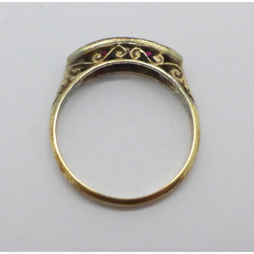 1006 - An 18ct gold ring set with two rubies, two diamonds and one small replacement white stone, 2.1g, N