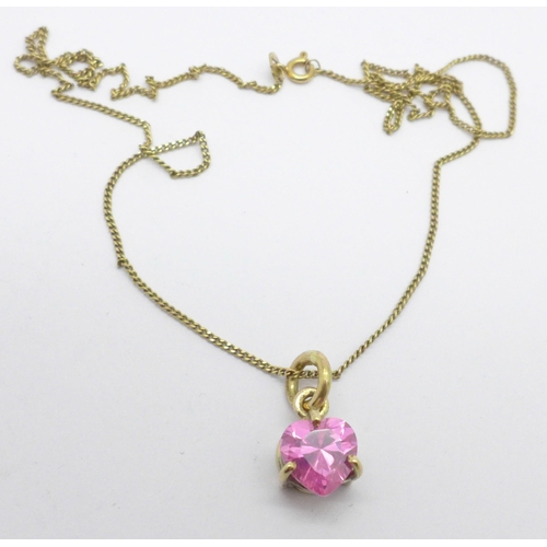 1008 - A 9ct gold pendant set with a heart shaped pink stone and a 9ct gold chain, 6.5g