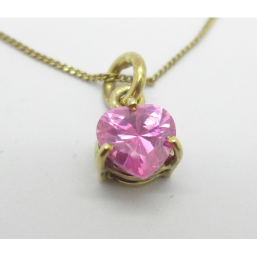 1008 - A 9ct gold pendant set with a heart shaped pink stone and a 9ct gold chain, 6.5g