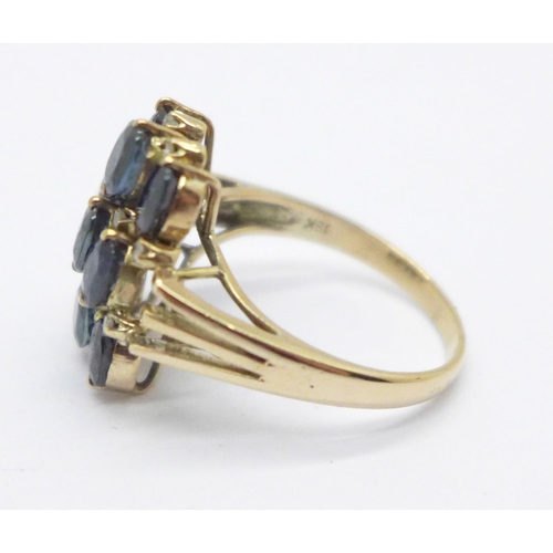 1011 - A yellow metal sapphire and diamond dress ring, marked 18K, 4.8g, R