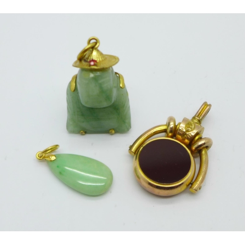 1023 - A Victorian plated fob and two jade pendants