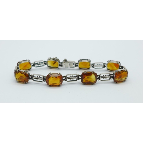 1031 - A 9ct white gold and citrine bracelet, total weight 10.9g