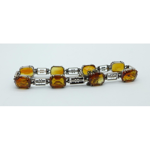 1031 - A 9ct white gold and citrine bracelet, total weight 10.9g