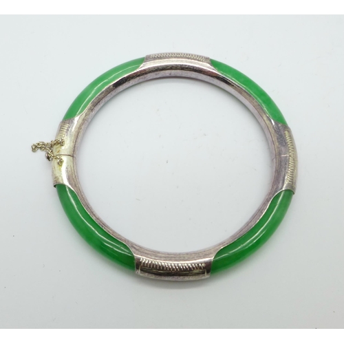 1035 - A silver and jade bangle