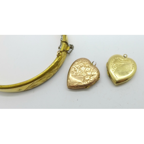 1037 - A 9ct gold metal core bangle and two 9ct gold back & front lockets, loops a/f