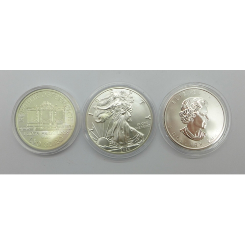 1052 - A 1oz Liberty 999 silver coin, a 1oz Maple 999 silver coin and an Austrian Philharmoniker 999 silver... 