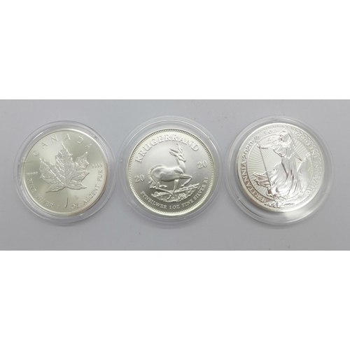 1053 - A 1oz Britannia 999 silver coin, a 1oz Krugerrand 999 silver coin and a 1oz maple 999 silver coin, (... 