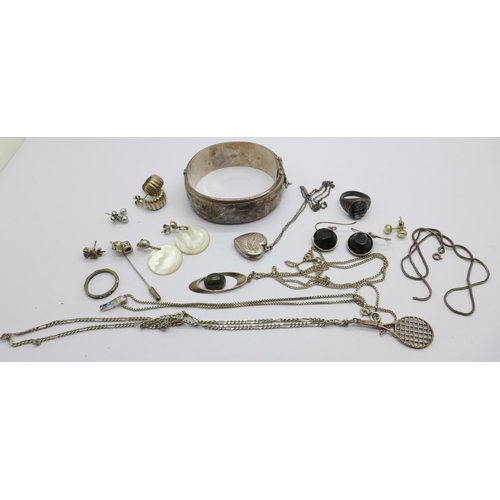 1068 - Silver jewellery including a bangle, pendants, a ring, etc.