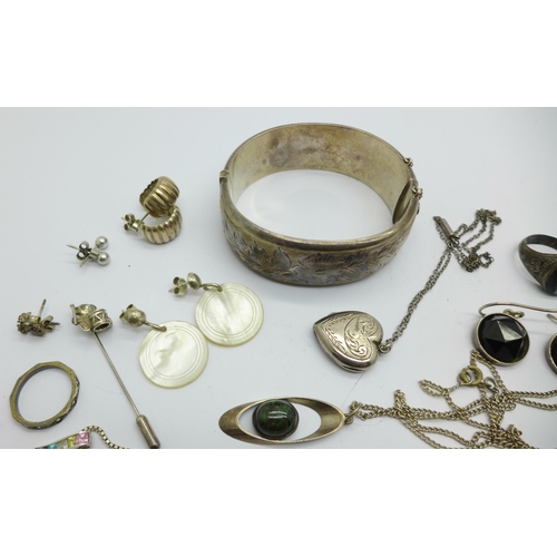 1068 - Silver jewellery including a bangle, pendants, a ring, etc.