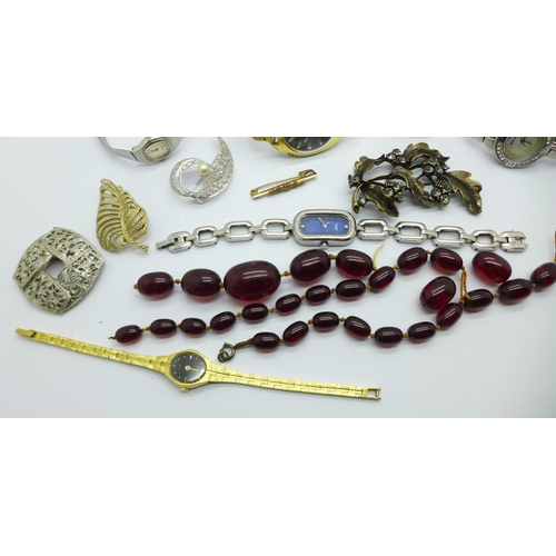 1069 - A collection of costume jewellery including wristwatches, a string of sherry amber coloured beads, a... 