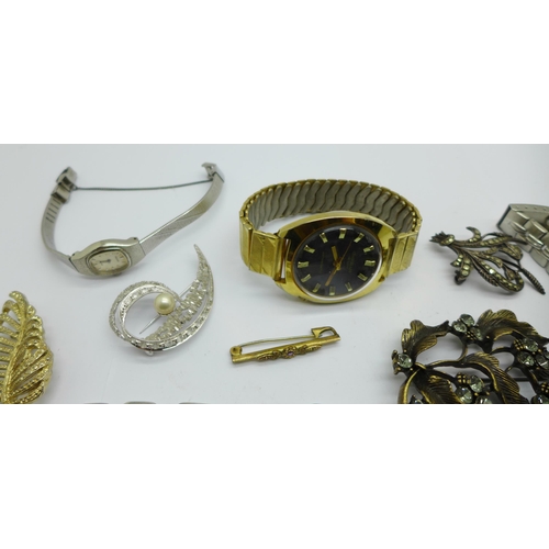 1069 - A collection of costume jewellery including wristwatches, a string of sherry amber coloured beads, a... 