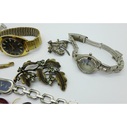 1069 - A collection of costume jewellery including wristwatches, a string of sherry amber coloured beads, a... 