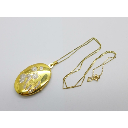 1075 - A 9ct gold locket and chain, 5.6g